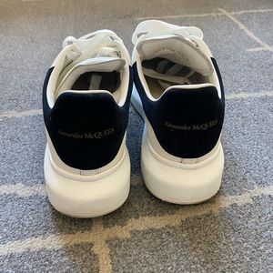 Size 7 women’s oversized Alexander McQueen sneaker in white/black.